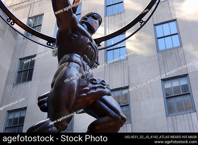 Statue of Atlas wearing face mask, Rockefeller Center, Manhattan, New York